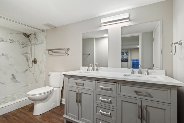 12133 Black Pine Trl, Homer Glen, IL 60491 - bathroom featuring double vanity, wood finished floors, and a marble finish shower