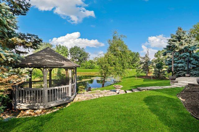 12133 Black Pine Trl, Homer Glen, IL 60491 - view of green lawn featuring a gazebo and a water view
