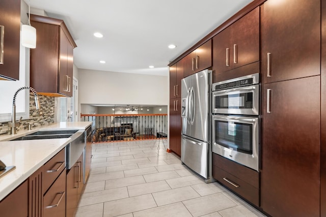 12133 Black Pine Trl, Homer Glen, IL 60491 - kitchen with appliances with stainless steel finishes, backsplash, recessed lighting, light tile patterned flooring, and light stone counters