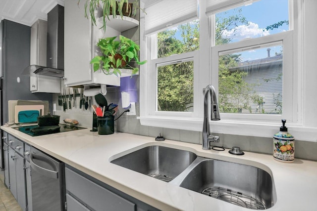 201 E Sherwin Dr, Urbana, IL 61802 - kitchen with gray cabinets, wall chimney exhaust hood, black electric cooktop, stainless steel dishwasher, and decorative backsplash