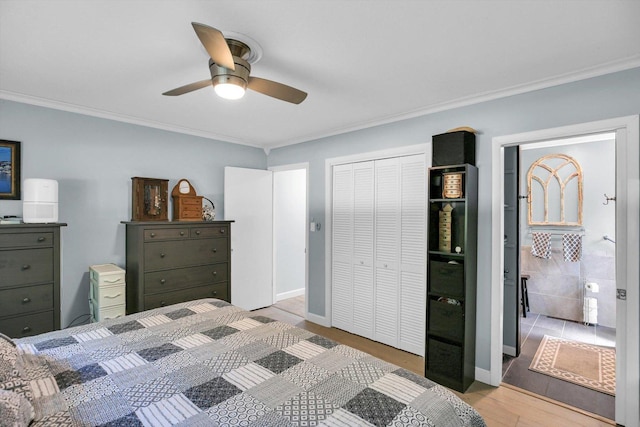 201 E Sherwin Dr, Urbana, IL 61802 - bedroom with ornamental molding, light wood-type flooring, a closet, and ceiling fan