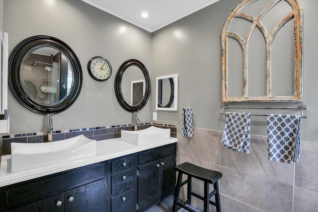 201 E Sherwin Dr, Urbana, IL 61802 - bathroom featuring tile walls, double vanity, a wainscoted wall, and ornamental molding