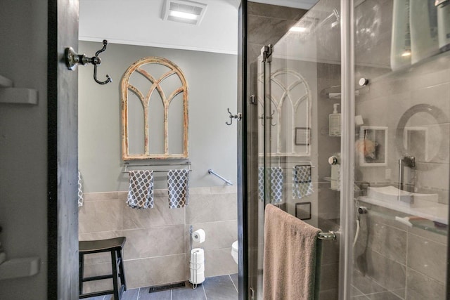 201 E Sherwin Dr, Urbana, IL 61802 - bathroom featuring tile walls, a stall shower, and tile patterned flooring