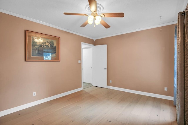 201 E Sherwin Dr, Urbana, IL 61802 - unfurnished bedroom featuring light wood-type flooring, crown molding, and ceiling fan