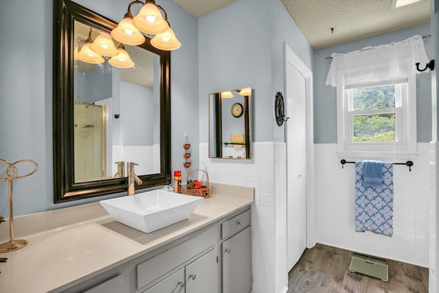 201 E Sherwin Dr, Urbana, IL 61802 - full bath featuring tile walls, vanity, wainscoting, and wood finished floors