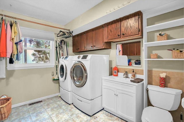 201 E Sherwin Dr, Urbana, IL 61802 - laundry room with independent washer and dryer and a textured ceiling