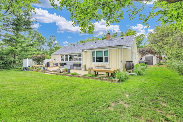 201 E Sherwin Dr, Urbana, IL 61802 - rear view of property featuring a patio area, a shed, a chimney, and a yard