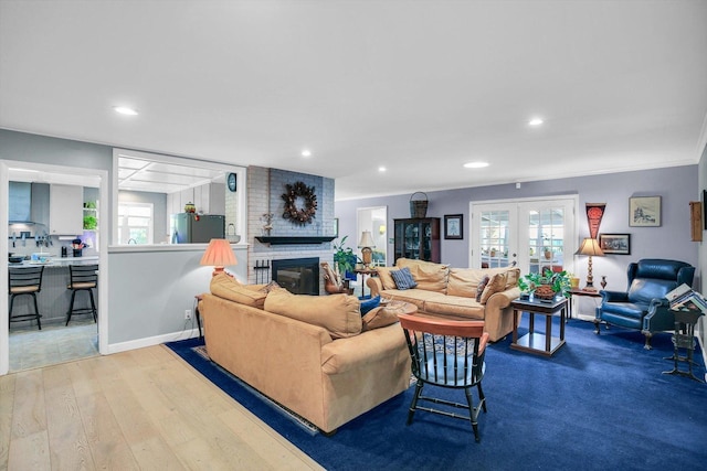 201 E Sherwin Dr, Urbana, IL 61802 - living area with french doors, recessed lighting, a fireplace, and wood finished floors