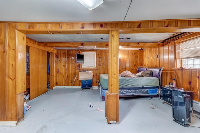 1336 Cuyler Ave, Berwyn, IL 60402 - bedroom with wood walls and concrete floors