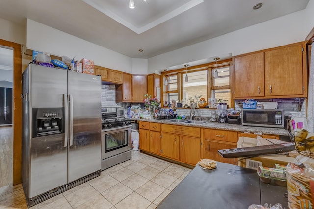 1336 Cuyler Ave, Berwyn, IL 60402 - kitchen with appliances with stainless steel finishes, tasteful backsplash, light tile patterned floors, and brown cabinets