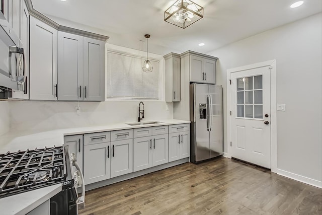 10510 S State St, Chicago, IL 60628 - kitchen featuring stainless steel appliances, light countertops, gray cabinetry, dark wood-style flooring, and recessed lighting