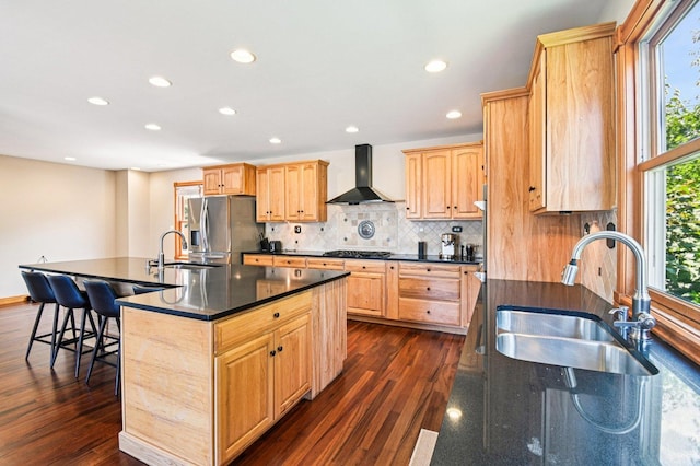 30 S Slusser St, Grayslake, IL 60030 - kitchen with wall chimney range hood, black gas stovetop, stainless steel refrigerator with ice dispenser, dark countertops, and recessed lighting