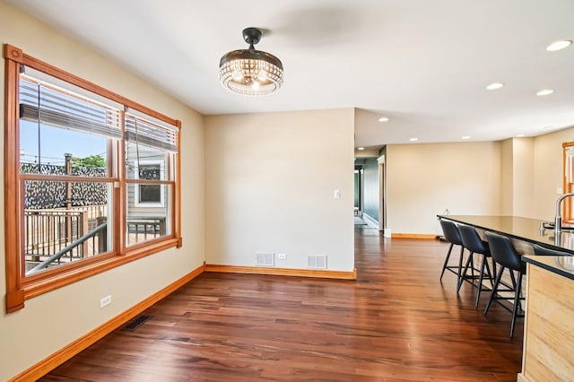 30 S Slusser St, Grayslake, IL 60030 - unfurnished dining area with dark wood-type flooring, a chandelier, and recessed lighting