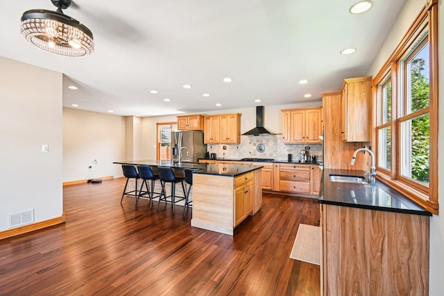 30 S Slusser St, Grayslake, IL 60030 - kitchen with wall chimney exhaust hood, dark countertops, healthy amount of natural light, dark wood-style flooring, and recessed lighting