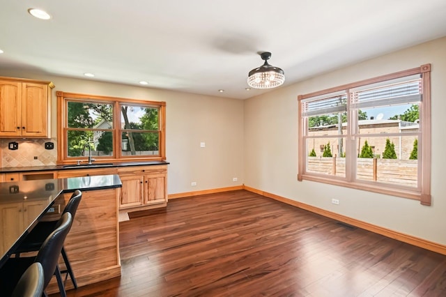 30 S Slusser St, Grayslake, IL 60030 - kitchen with dark countertops, dark wood-style floors, recessed lighting, tasteful backsplash, and decorative light fixtures