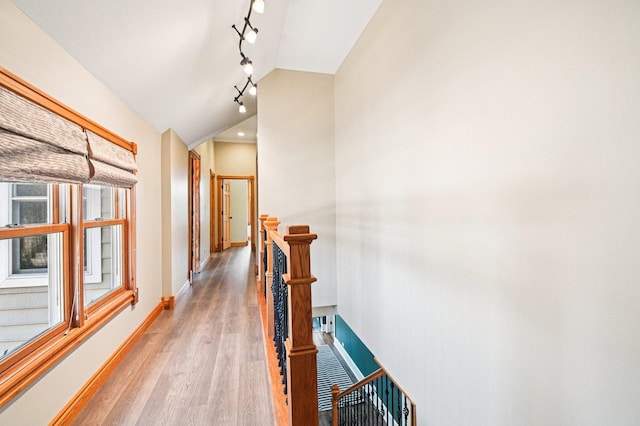 30 S Slusser St, Grayslake, IL 60030 - hallway with an upstairs landing, rail lighting, light wood-style floors, and vaulted ceiling