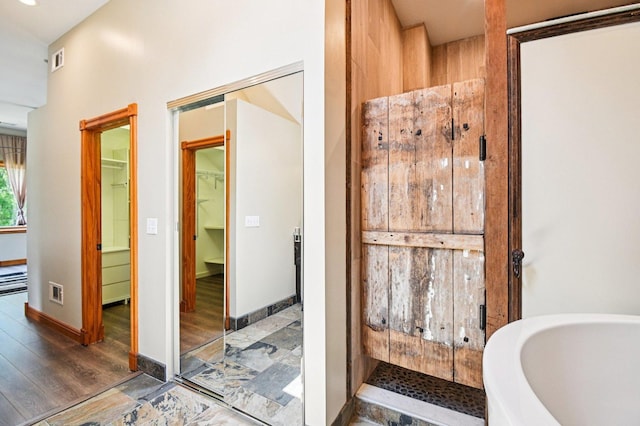 30 S Slusser St, Grayslake, IL 60030 - bathroom with stone finish floors and a walk in closet