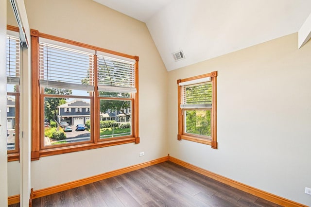 30 S Slusser St, Grayslake, IL 60030 - empty room with wood finished floors and lofted ceiling