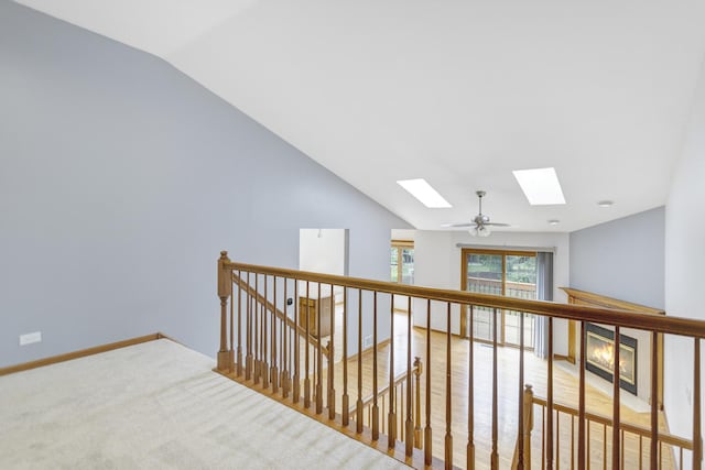 924 Millcreek Cir, Elgin, IL 60123 - corridor with a skylight, an upstairs landing, vaulted ceiling, and carpet