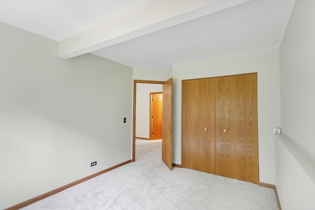 924 Millcreek Cir, Elgin, IL 60123 - unfurnished bedroom with carpet flooring, a closet, and beamed ceiling