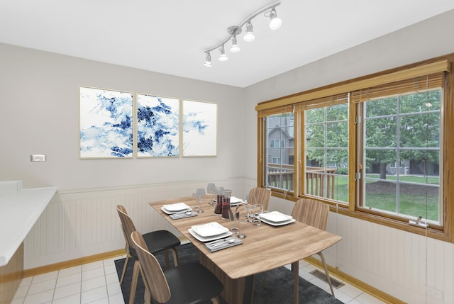 924 Millcreek Cir, Elgin, IL 60123 - dining area with light tile patterned flooring, plenty of natural light, and a wainscoted wall