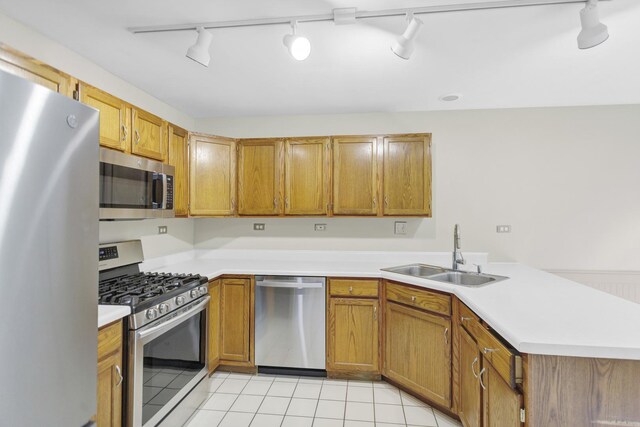 924 Millcreek Cir, Elgin, IL 60123 - kitchen featuring stainless steel appliances, rail lighting, a peninsula, and light countertops