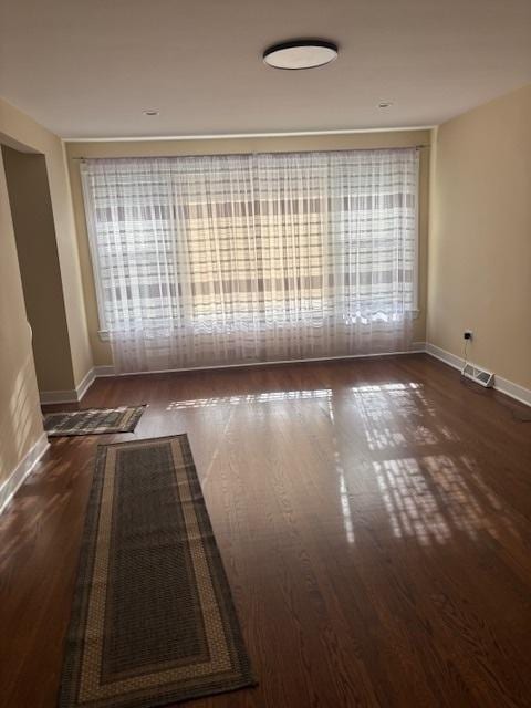 5131 S Latrobe Ave, Chicago, IL 60638 - unfurnished room with baseboards and wood finished floors