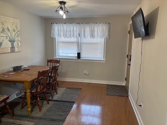 5131 S Latrobe Ave, Chicago, IL 60638 - dining area featuring hardwood / wood-style floors and baseboards