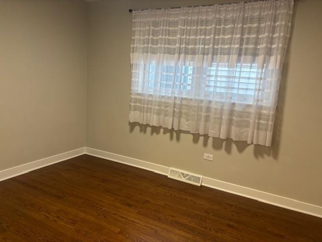 5131 S Latrobe Ave, Chicago, IL 60638 - unfurnished room featuring dark wood finished floors and baseboards