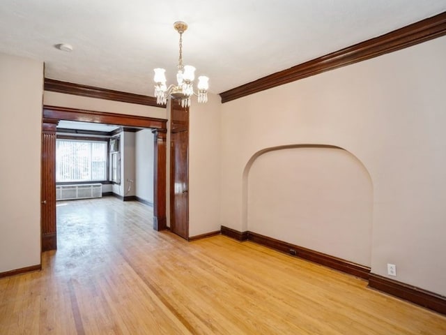 7120 S Eberhart Ave, Chicago, IL 60619 - unfurnished room with ornamental molding, a chandelier, light wood-type flooring, and a smoke detector