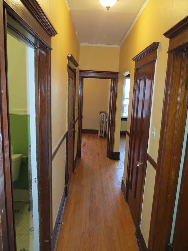 7120 S Eberhart Ave, Chicago, IL 60619 - hall featuring ornamental molding, hardwood / wood-style floors, radiator, arched walkways, and french doors