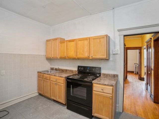 7120 S Eberhart Ave, Chicago, IL 60619 - kitchen with black electric range oven, tile walls, dark countertops, a wainscoted wall, and ornamental molding