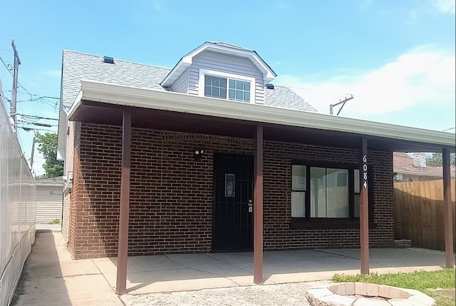 6084 S 75th Ave, Summit, IL 60501 - view of front of home featuring brick siding, roof with shingles, and a patio