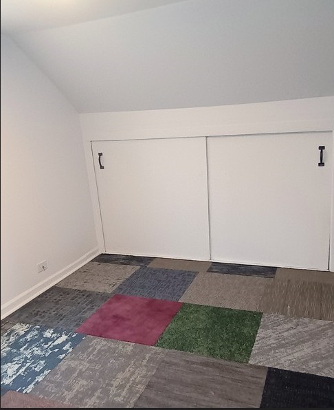 6084 S 75th Ave, Summit, IL 60501 - bonus room featuring baseboards and vaulted ceiling