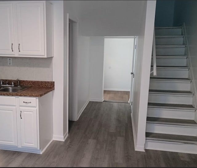 6084 S 75th Ave, Summit, IL 60501 - kitchen featuring dark wood-type flooring, white cabinets, and dark countertops