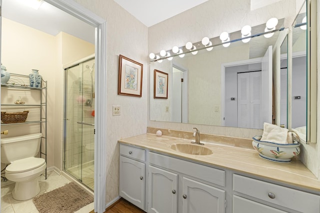 50 Lake Blvd Unit 627, Buffalo Grove, IL 60089 - bathroom featuring a stall shower, vanity, a closet, and tile patterned floors
