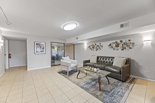 50 Lake Blvd Unit 627, Buffalo Grove, IL 60089 - living room with light tile patterned floors and baseboards