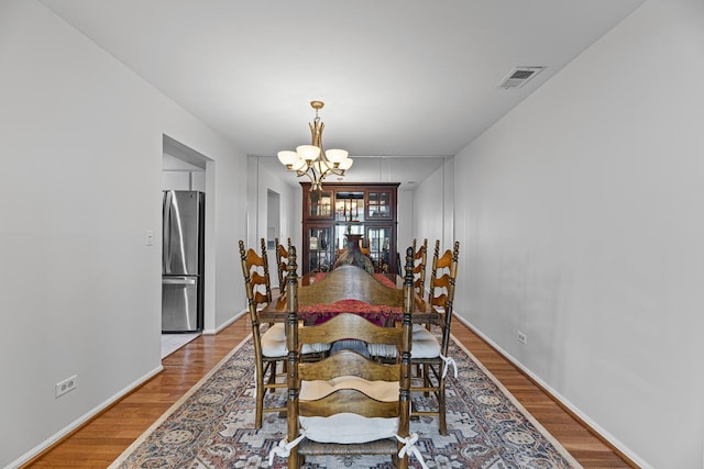 50 Lake Blvd Unit 627, Buffalo Grove, IL 60089 - dining area featuring a chandelier and light wood-style floors