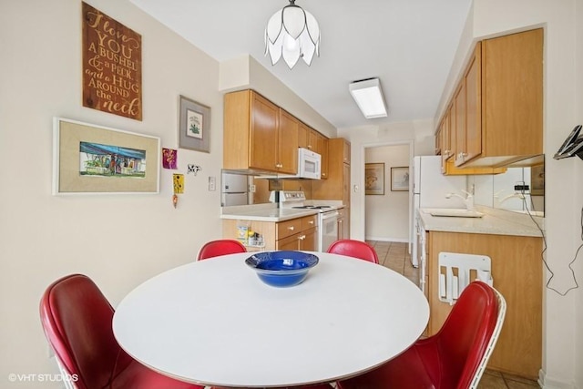 1280 Rudolph Rd Unit 1K, Northbrook, IL 60062 - dining space with light tile patterned floors