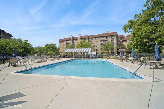 1280 Rudolph Rd Unit 1K, Northbrook, IL 60062 - community pool featuring a patio area
