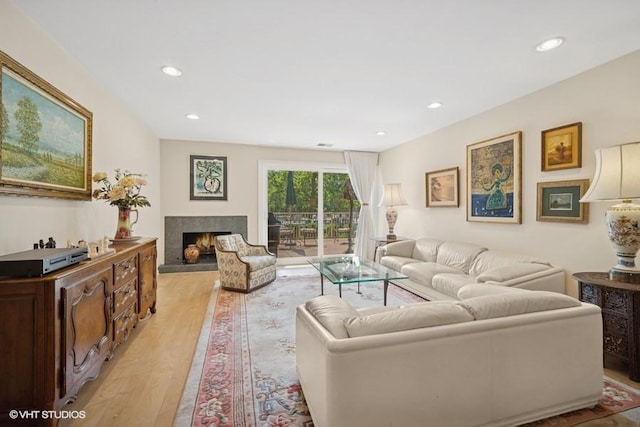 1280 Rudolph Rd Unit 1K, Northbrook, IL 60062 - living room featuring light wood-style flooring, a lit fireplace, and recessed lighting