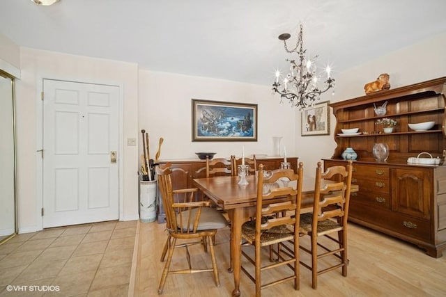 1280 Rudolph Rd Unit 1K, Northbrook, IL 60062 - dining area with a chandelier and light tile patterned floors