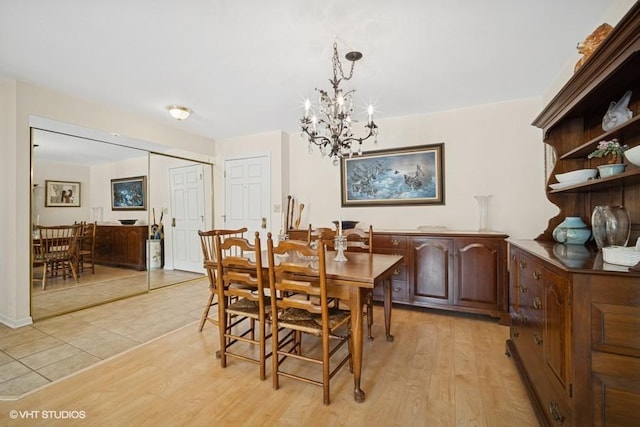 1280 Rudolph Rd Unit 1K, Northbrook, IL 60062 - dining space featuring a chandelier and light wood-type flooring