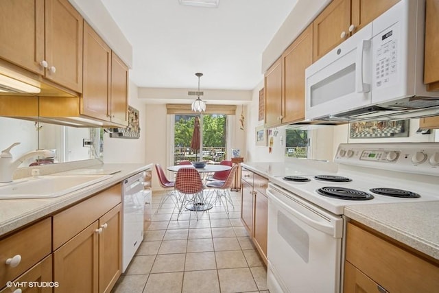 1280 Rudolph Rd Unit 1K, Northbrook, IL 60062 - kitchen featuring white appliances, light countertops, light tile patterned floors, and hanging light fixtures