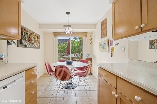 1280 Rudolph Rd Unit 1K, Northbrook, IL 60062 - dining area with light tile patterned floors and baseboards