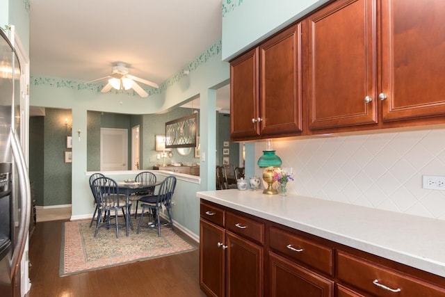 750 Pearson St Unit 904, Des Plaines, IL 60016 - kitchen featuring light countertops, dark wood-style flooring, ceiling fan, decorative backsplash, and stainless steel refrigerator with ice dispenser