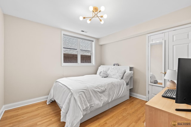 3507 N Reta Ave Unit 4, Chicago, IL 60657 - bedroom featuring a chandelier and light wood-style floors