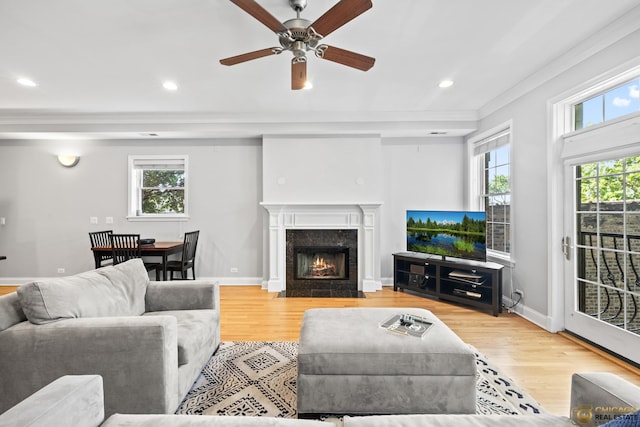 3507 N Reta Ave Unit 4, Chicago, IL 60657 - living room with crown molding, healthy amount of natural light, ceiling fan, wood finished floors, and recessed lighting