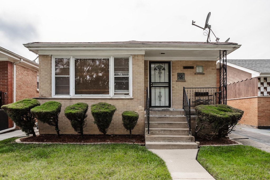 16530 Emerald Ave, Harvey, IL 60426 - view of front of home featuring brick siding and a porch
