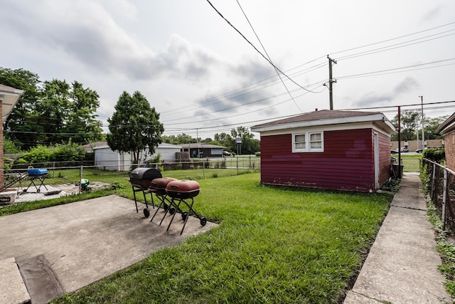 16530 Emerald Ave, Harvey, IL 60426 - fenced backyard featuring a patio area and an outdoor structure